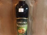 a bottle of olive oil sitting on a counter