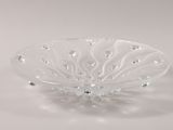clear glass bowl with a decorative design on the rim