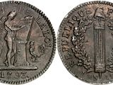 a silver coin with an image of a man holding a sword