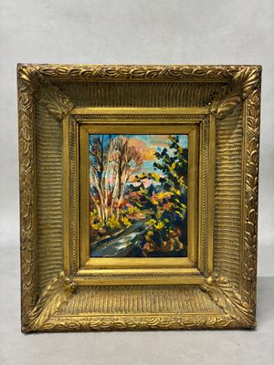 un tableau représentant une route bordée d'arbres et de buissons, dans un cadre doré