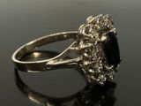 an image of a black diamond ring on a black surface