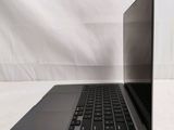 an open laptop computer sitting on top of a white surface