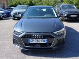 a black audi car parked in a parking lot