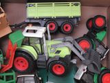 a box full of toy vehicles and trucks in it