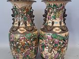 two vases that are sitting on a table