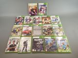 the xbox game collection is displayed on a table in front of a gray background