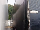 a truck that is parked next to a building