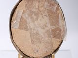 a picture of a picture of a round object on a stand