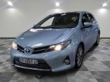 a picture of a blue toyota corollant parked on a checkered floor
