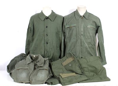 three military uniforms are displayed on a mannequin display
