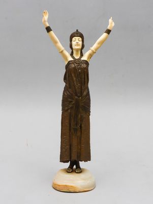 statue of a woman with her arms raised in the air
