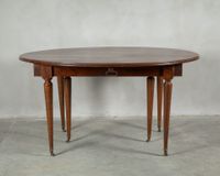 Table oblongue en bois naturel mouluré à abattants et allong…