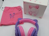 purple and pink hello kitty headphones with a pink bag