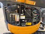 a close up view of the engine of a construction vehicle