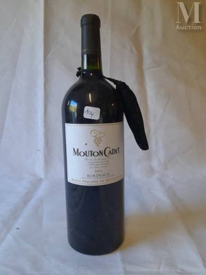 a bottle of wine that is sitting on a table