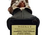 figurine of a mouse sitting on top of a black suitcase