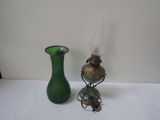 two green vases sitting on a white table