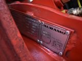 a close up of a red fire hydrant with a sign on it