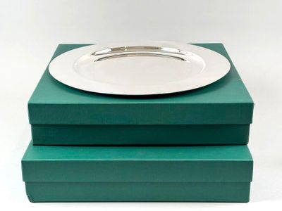 two green boxes with a white plate on top of them