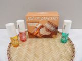 a basket with a lot of cosmetics and a bottle of lotion on it