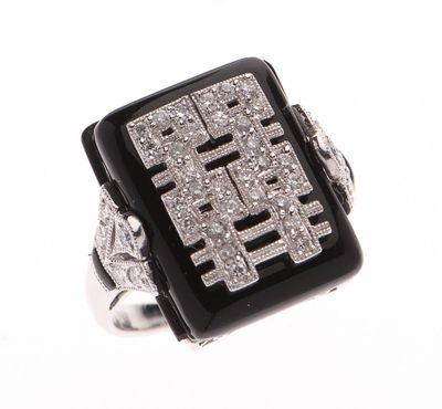 BAGUE cocktail en or gris 750 °/°° ornée d'une plaque d'onyx…