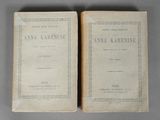 two old books sitting on top of a table next to each other