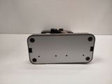a silver suitcase sitting on top of a white table