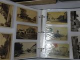 an open book with pictures on it on a table