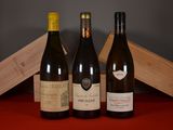 three bottles of wine sitting next to each other on a table
