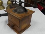 a small wooden box on a table next to a lamp