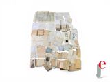 a pile of old papers on a white surface