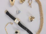 an image of a collection of jewelry including a pen, bracelet, and ring