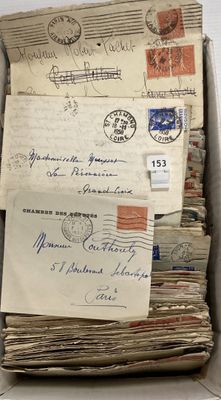 a box full of old letters and envelopes on the table
