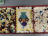 two trays of beads and beads are sitting on a table