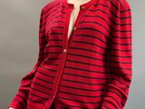 a red and black striped cardigan sweater on a mannequin mannequin
