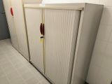a bathroom stall with a red handle on the door