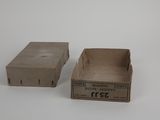 two empty boxes sitting on top of each other on a white surface