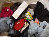 a pile of clothes that is sitting on the floor