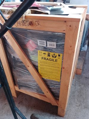 a bike that is parked in front of a box