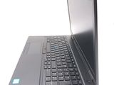 a laptop that is open on a white surface