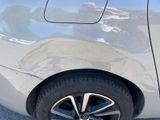 a close up of a car ' s tire on the pavement