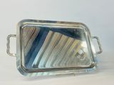 silver plated serving tray with handles and handles on a white surface
