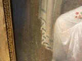 a painting of a woman in a white dress sitting on a chair