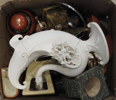 a box full of assorted items including a horn