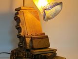 a lamp that is sitting on top of a pile of books