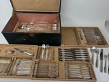 many different types of silverware in a box