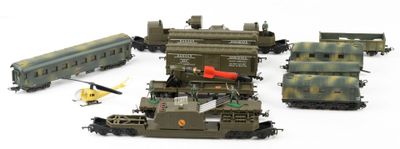 several toy trains and a helicopter on a white surface