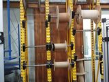 a picture of a gym room with a rack full of equipment