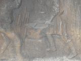 a statue of a man and a woman sitting at a table