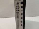 a close up of a black and white device on a white surface